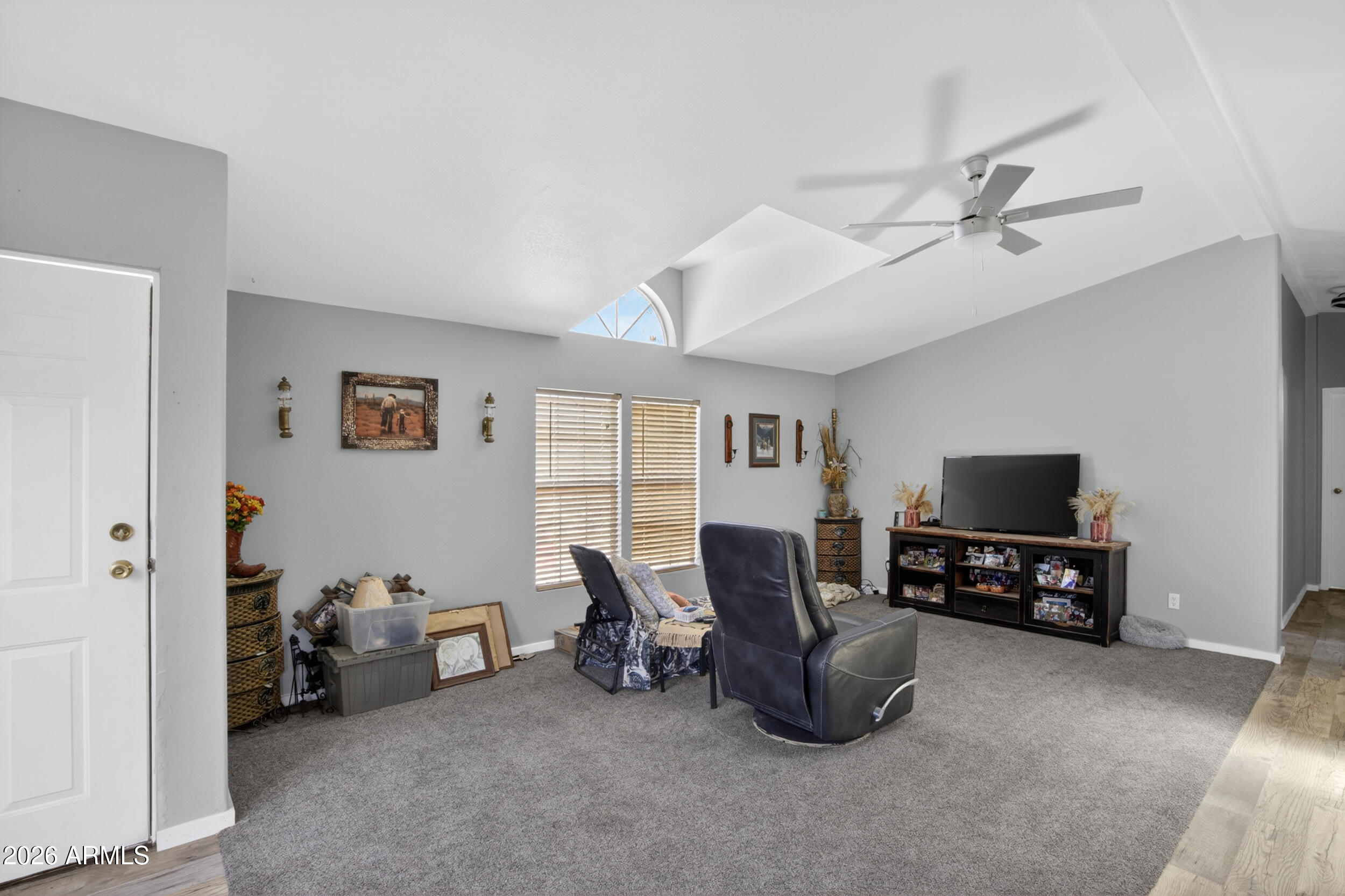 38809 East Spotted Horse Road Florence, AZ 85132 - Photo 10 of 40 a living room with furniture and a flat screen tv