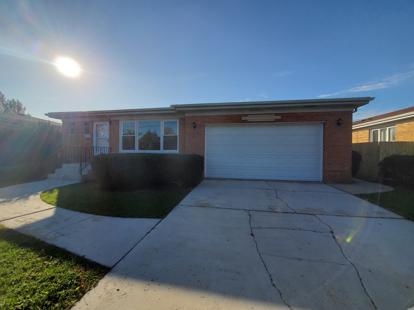 8307 Ballard Road Niles, IL 60714 - Photo 2 of 22 a front view of a house with a yard and garage