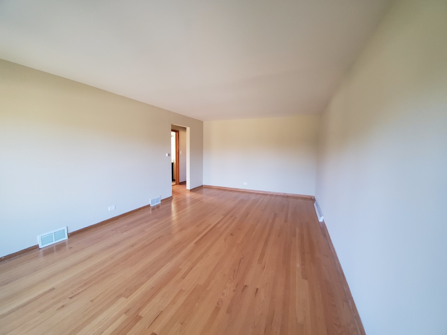 8307 Ballard Road Niles, IL 60714 - Photo 4 of 22 a view of empty room with wooden floor