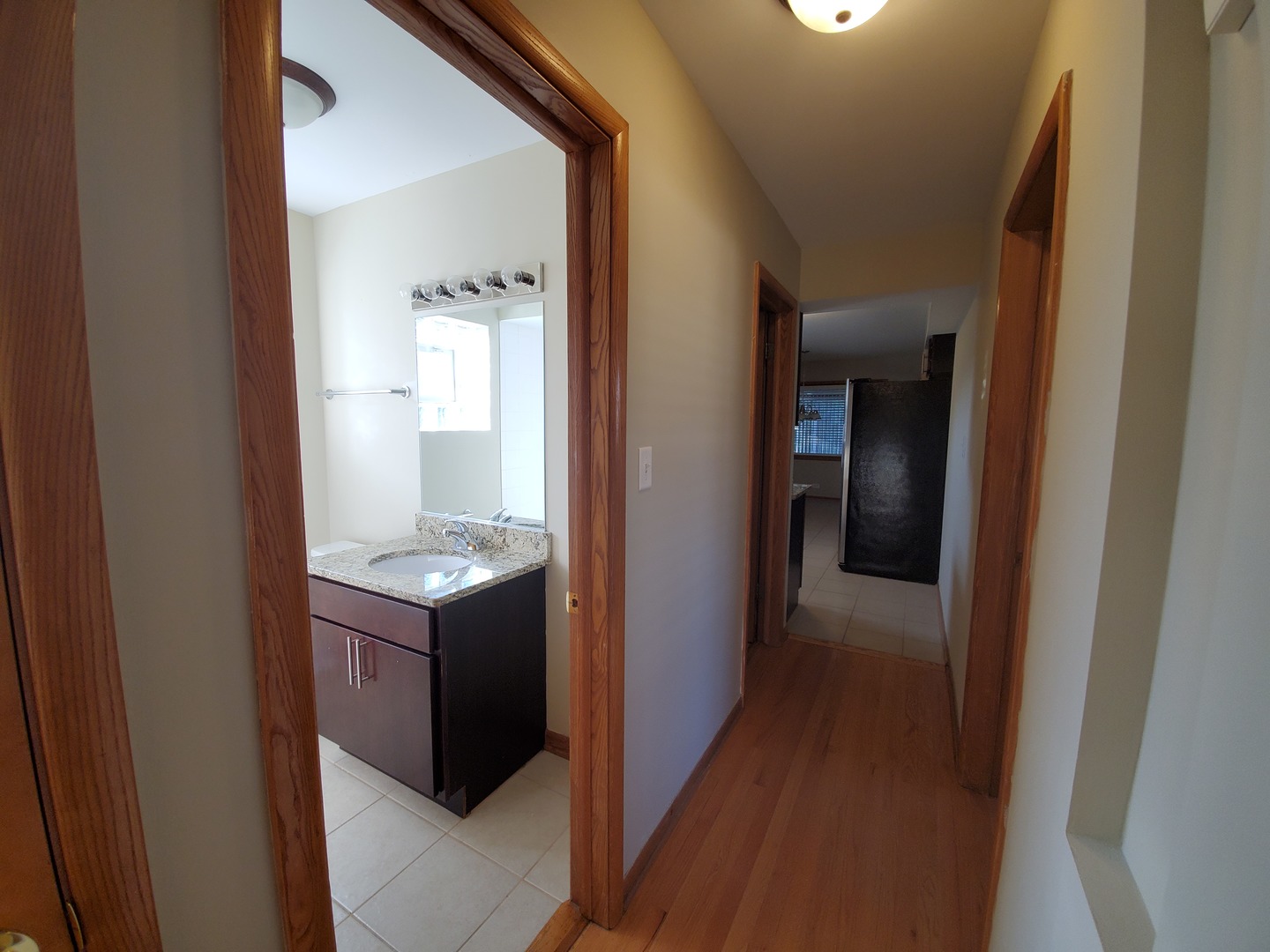 8307 Ballard Road Niles, IL 60714 - Photo 6 of 22 a view of a bathroom from a hallway