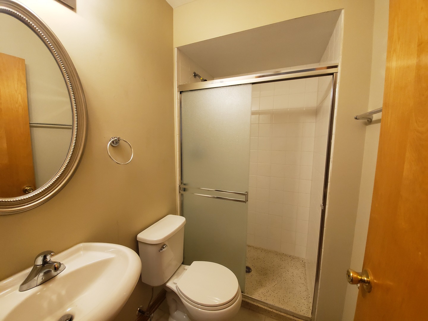 8307 Ballard Road Niles, IL 60714 - Photo 9 of 22 a bathroom with a sink and a mirror