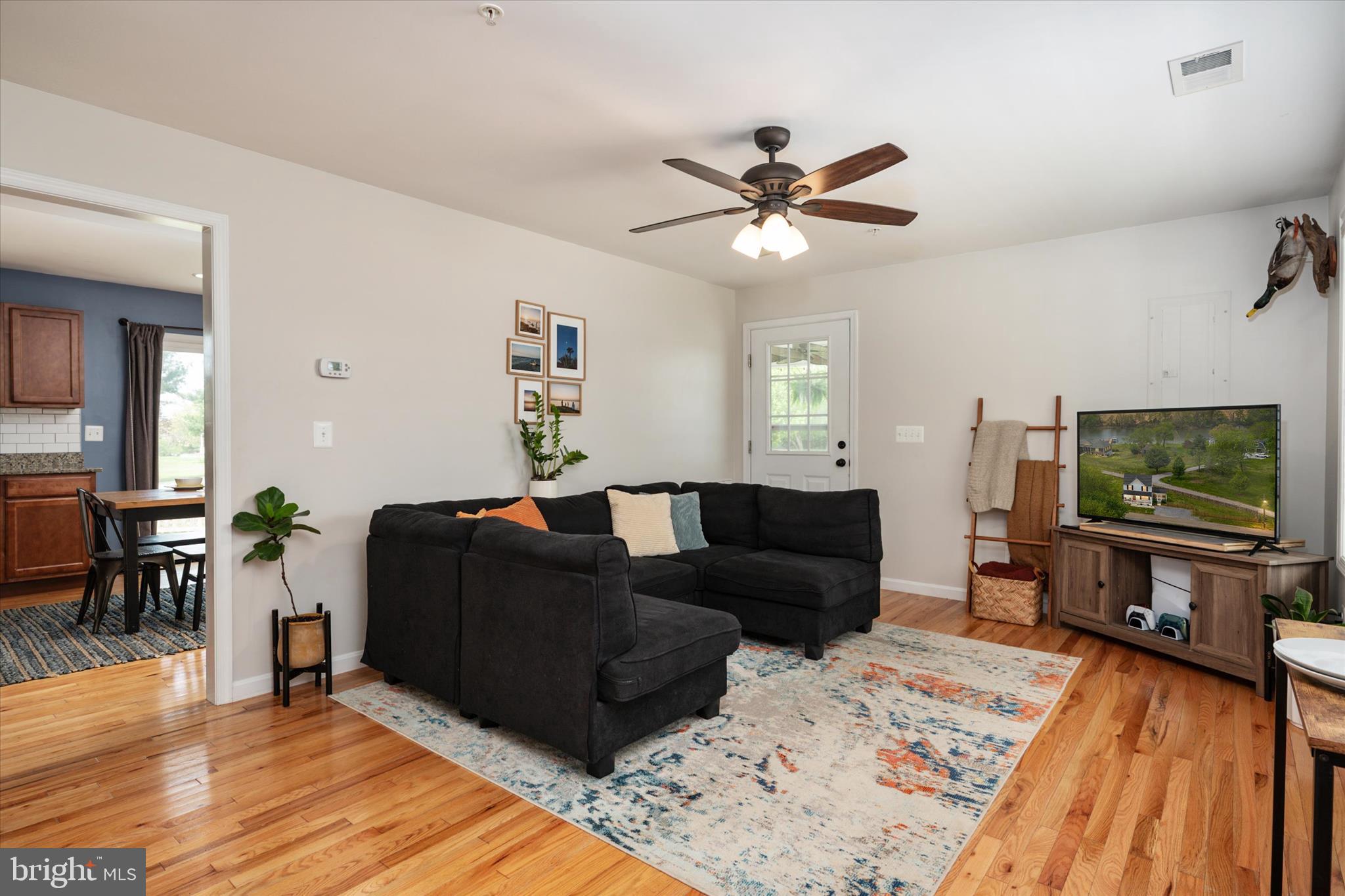 200 Newtown Road Chester, MD 21619 - Photo 11 of 50 a living room with furniture and a flat screen tv