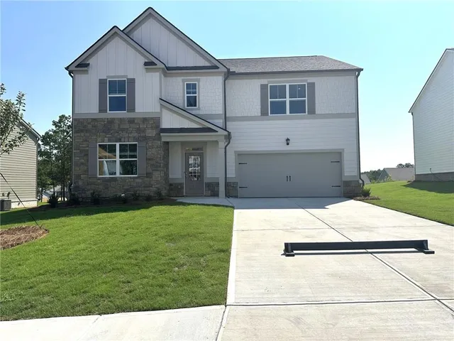 a house view with a backyard space