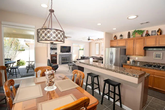 a very nice looking dining room with a table and chairs