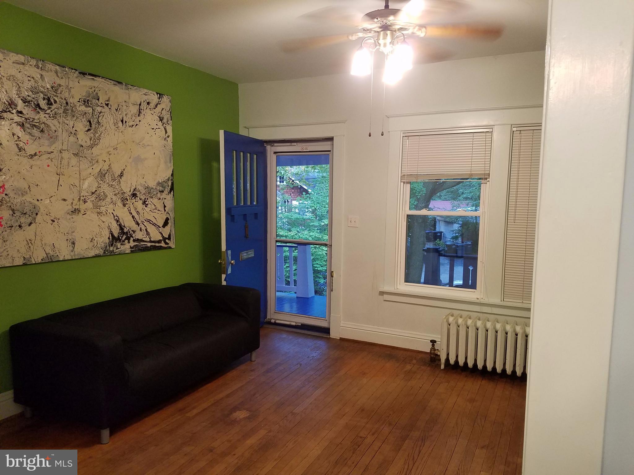 4429 P Street Northwest Washington, DC 20007 - Photo 5 of 11 a living room with furniture and a window