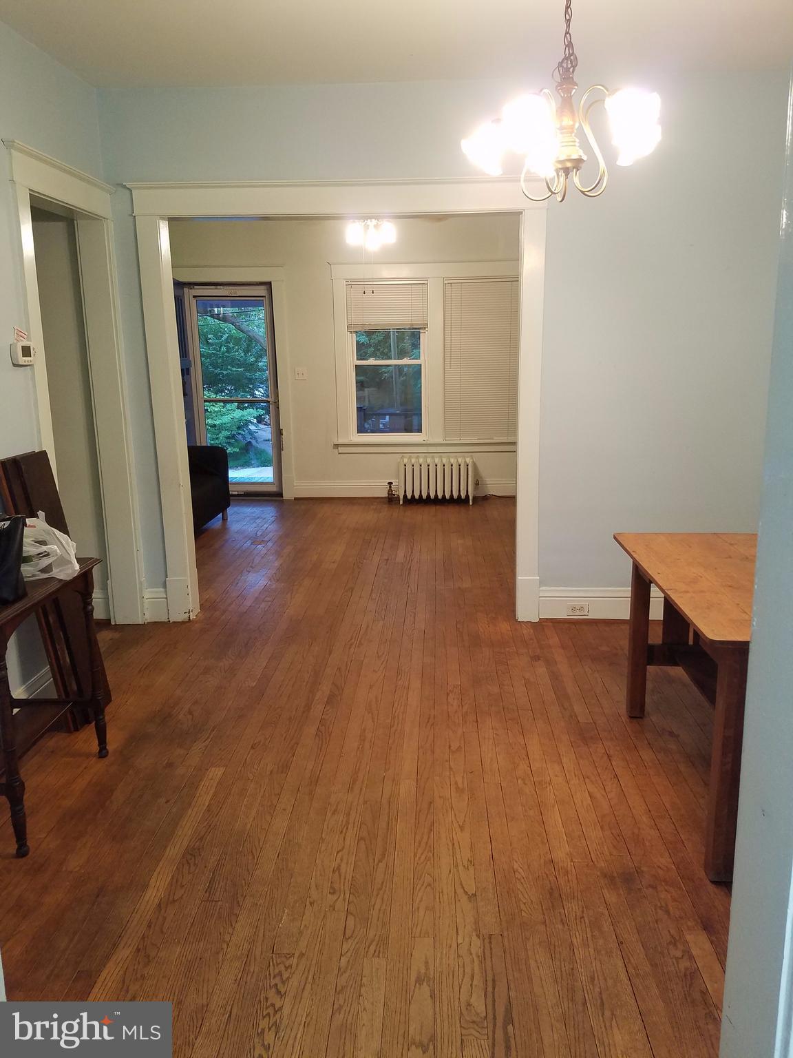 4429 P Street Northwest Washington, DC 20007 - Photo 8 of 11 a view of a room with wooden floor staircase and a bathroom