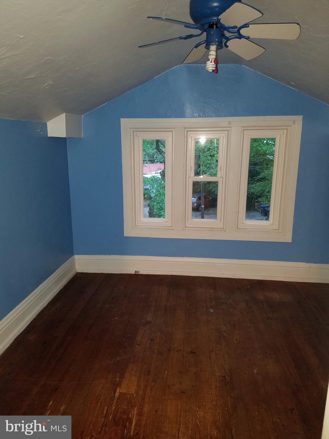 4429 P Street Northwest Washington, DC 20007 - Photo 10 of 11 a view of an empty room with wooden floor and a window