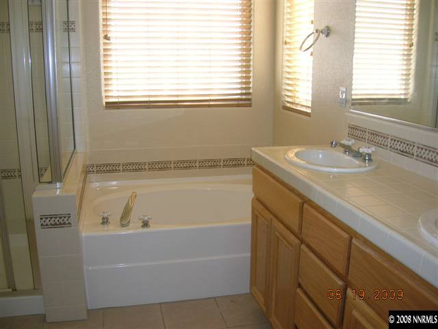 1810 Granite Chief Drive Reno, NV 89521 - Photo 5 of 9 a bathroom with a bathtub and a sink