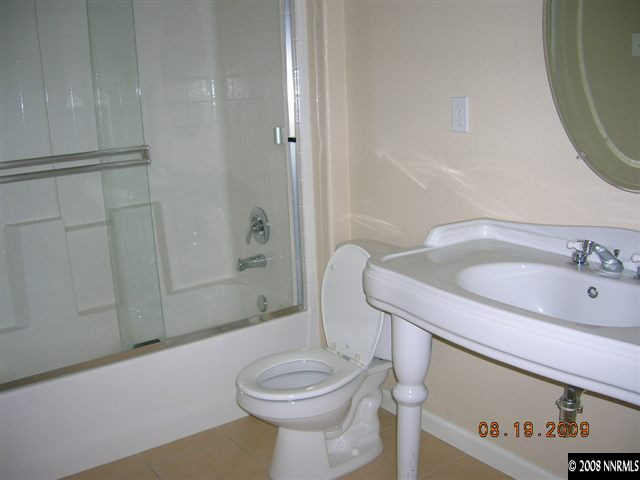 1810 Granite Chief Drive Reno, NV 89521 - Photo 8 of 9 a bathroom with a sink a toilet and shower