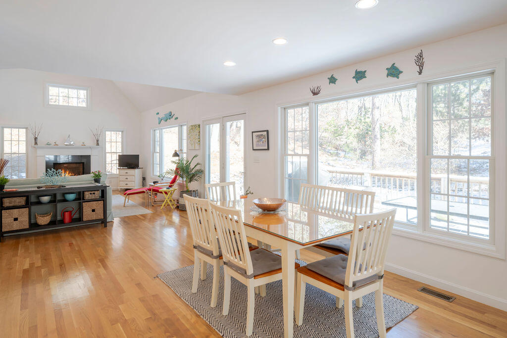 45 Perch Pond Way Wellfleet, MA 02667 - Photo 27 of 82 a view of a dining room with furniture window and wooden floor