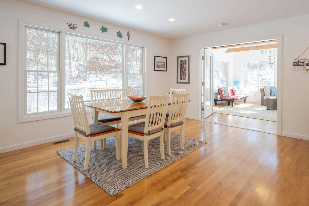 45 Perch Pond Way Wellfleet, MA 02667 - Photo 31 of 82 a view of a dining room with furniture and wooden floor