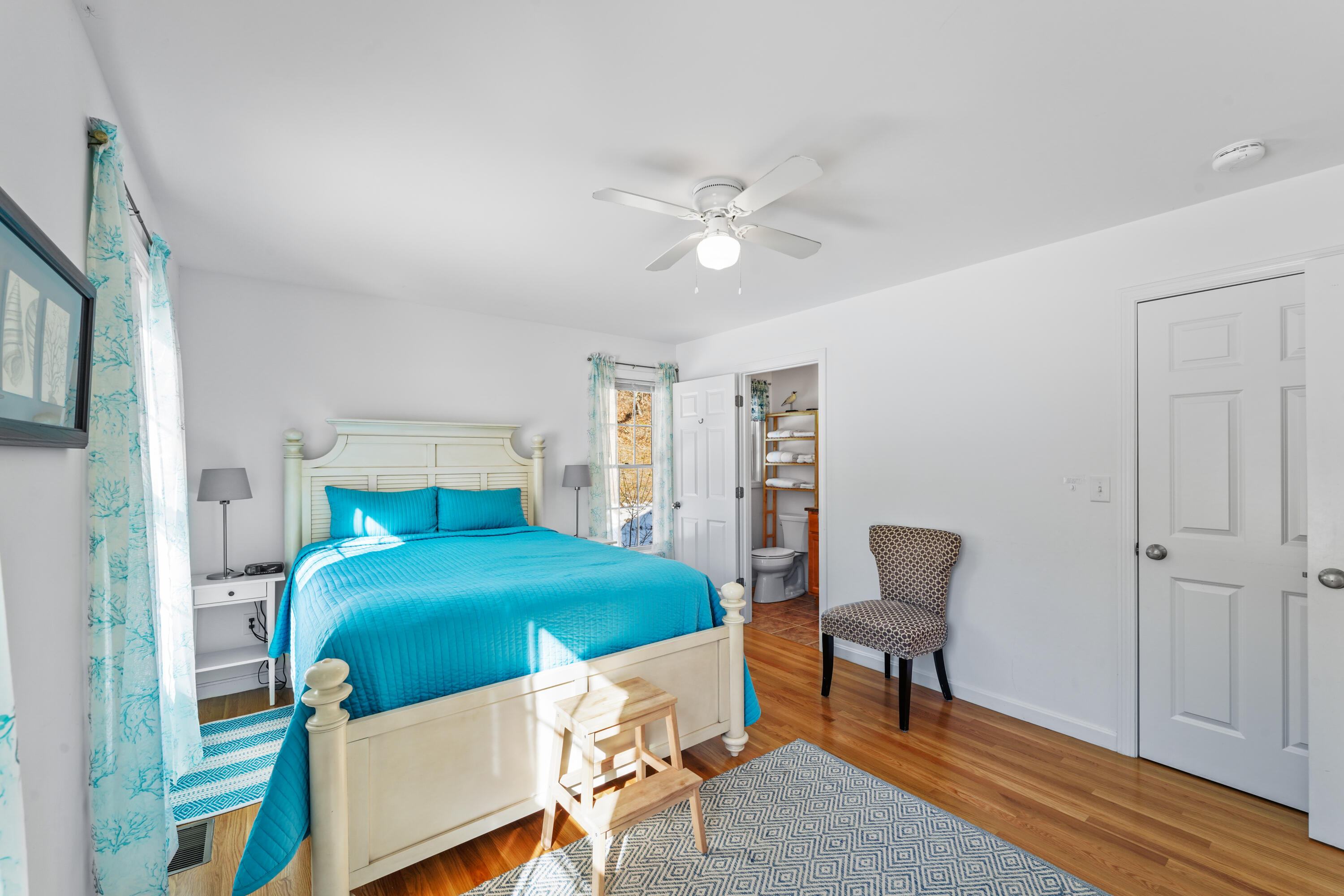 45 Perch Pond Way Wellfleet, MA 02667 - Photo 37 of 82 a bedroom with a bed and a chandelier