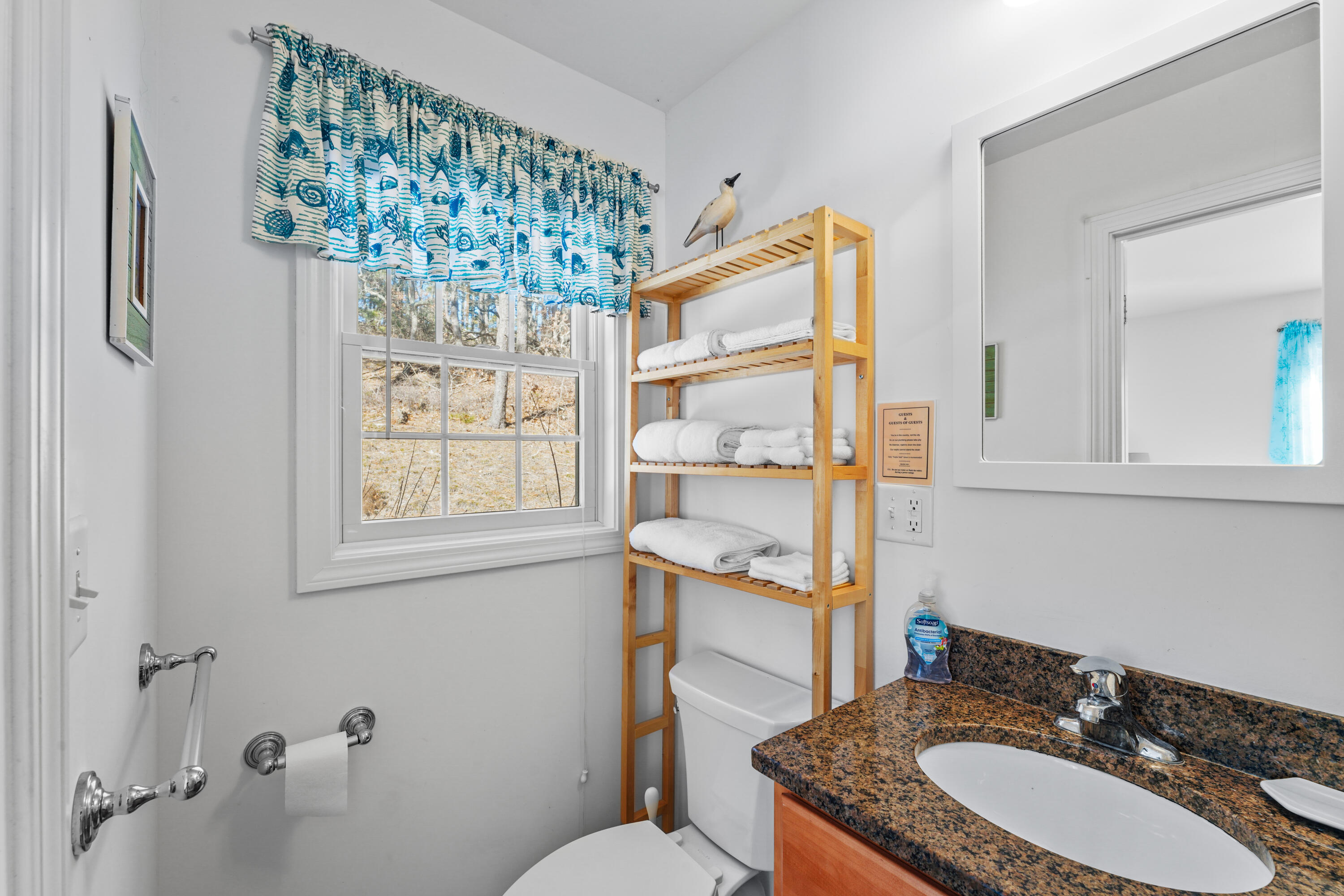 45 Perch Pond Way Wellfleet, MA 02667 - Photo 40 of 82 a bathroom with a granite countertop sink a mirror and a toilet