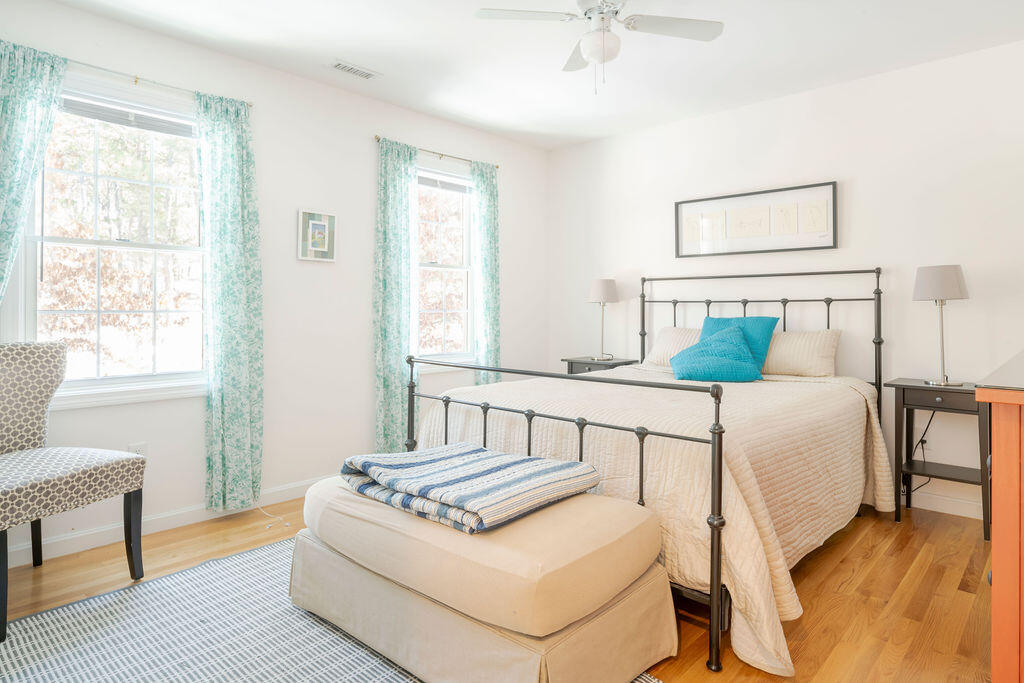 45 Perch Pond Way Wellfleet, MA 02667 - Photo 55 of 82 a bedroom with a bed and wooden floor