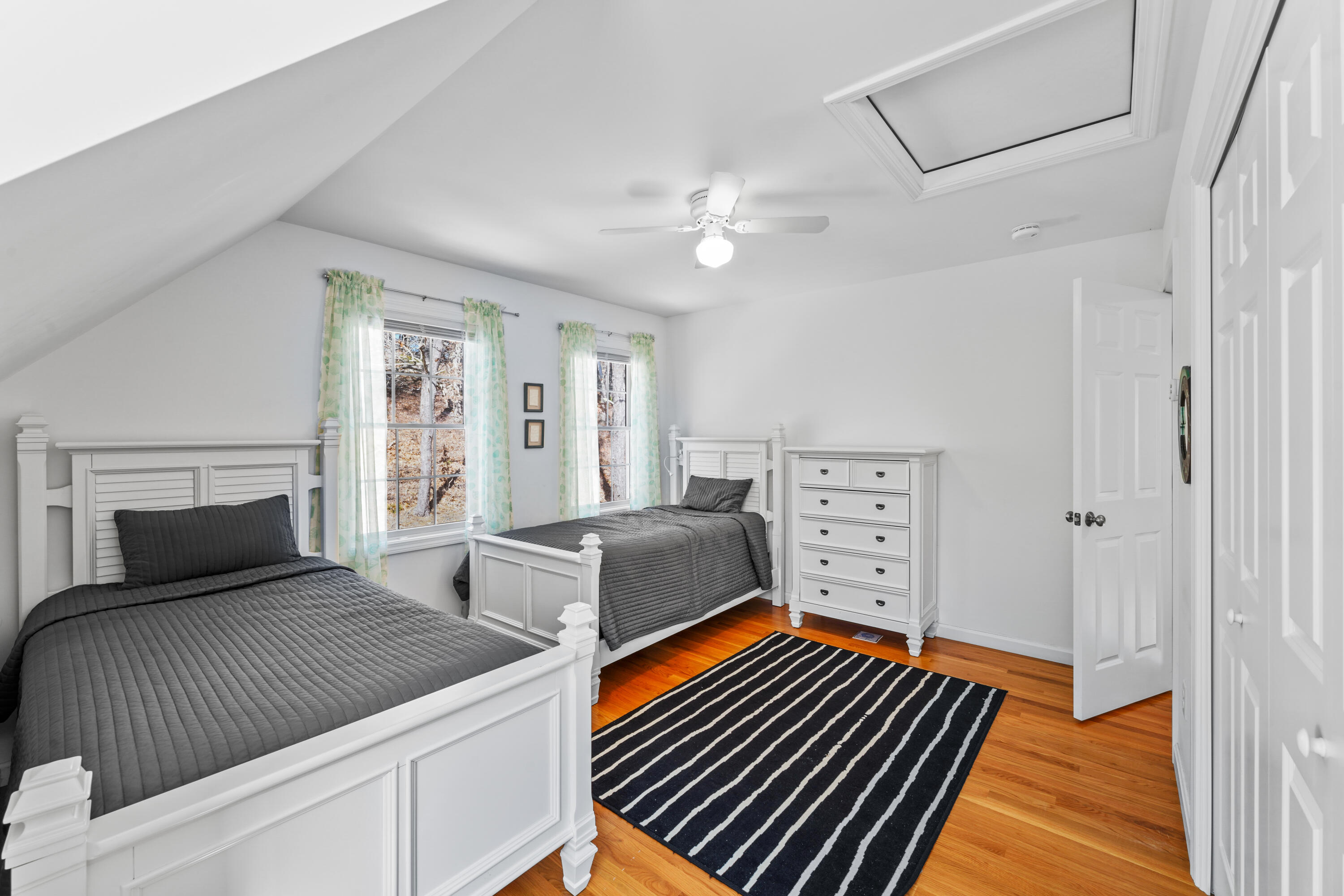 45 Perch Pond Way Wellfleet, MA 02667 - Photo 59 of 82 a bedroom with a bed and wooden floor