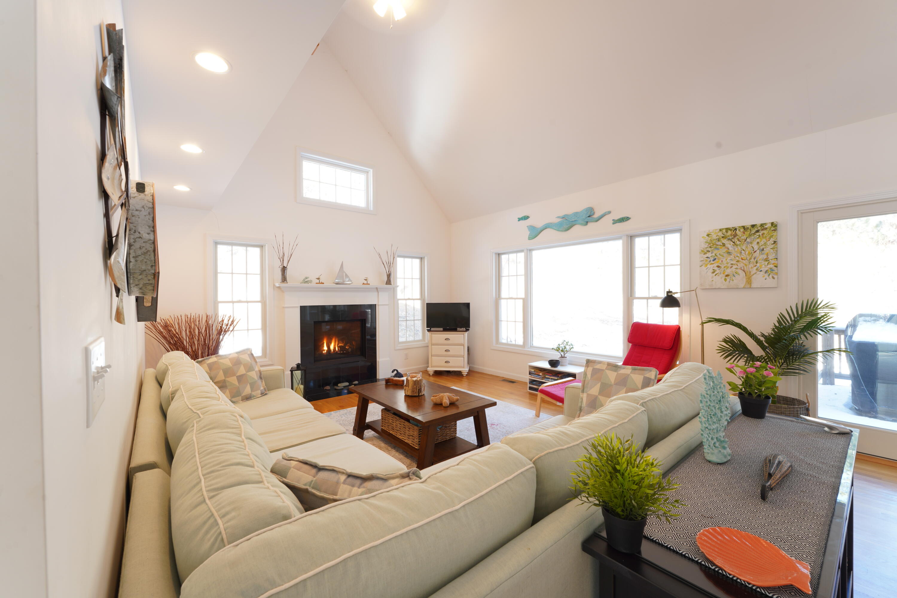 45 Perch Pond Way Wellfleet, MA 02667 - Photo 6 of 82 a living room with furniture and a fireplace