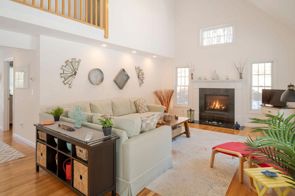 45 Perch Pond Way Wellfleet, MA 02667 - Photo 7 of 82 a living room with furniture and a fireplace