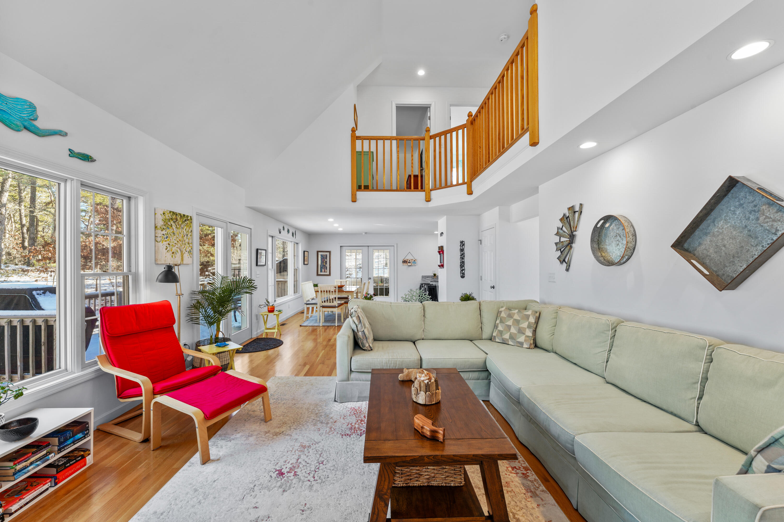 45 Perch Pond Way Wellfleet, MA 02667 - Photo 10 of 82 a living room with furniture kitchen view and a large window