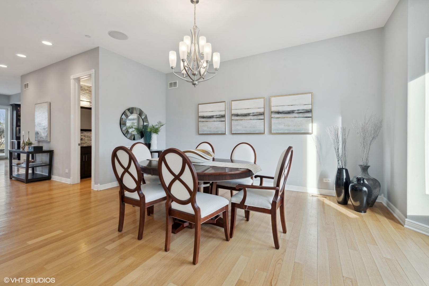 1853 Checker Road Long Grove, IL 60047 - Photo 12 of 63 a view of a dining room with furniture and wooden floor