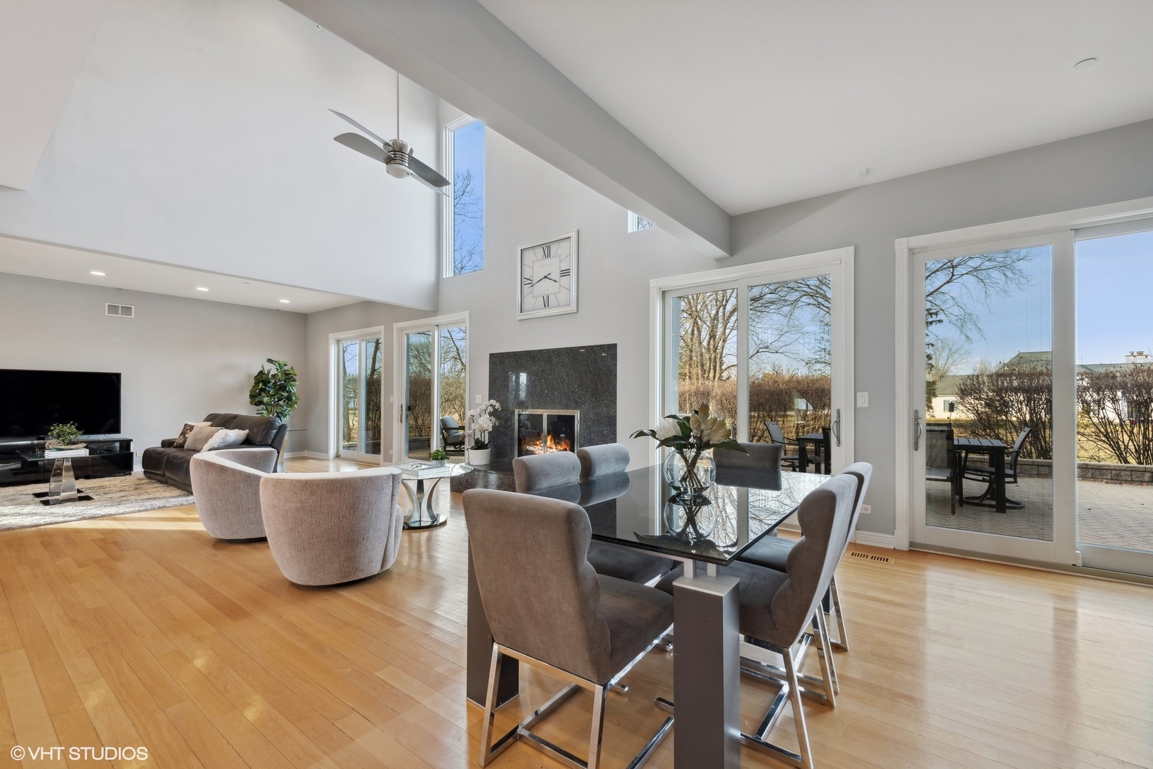 1853 Checker Road Long Grove, IL 60047 - Photo 22 of 63 a living room with fireplace furniture and a flat screen tv