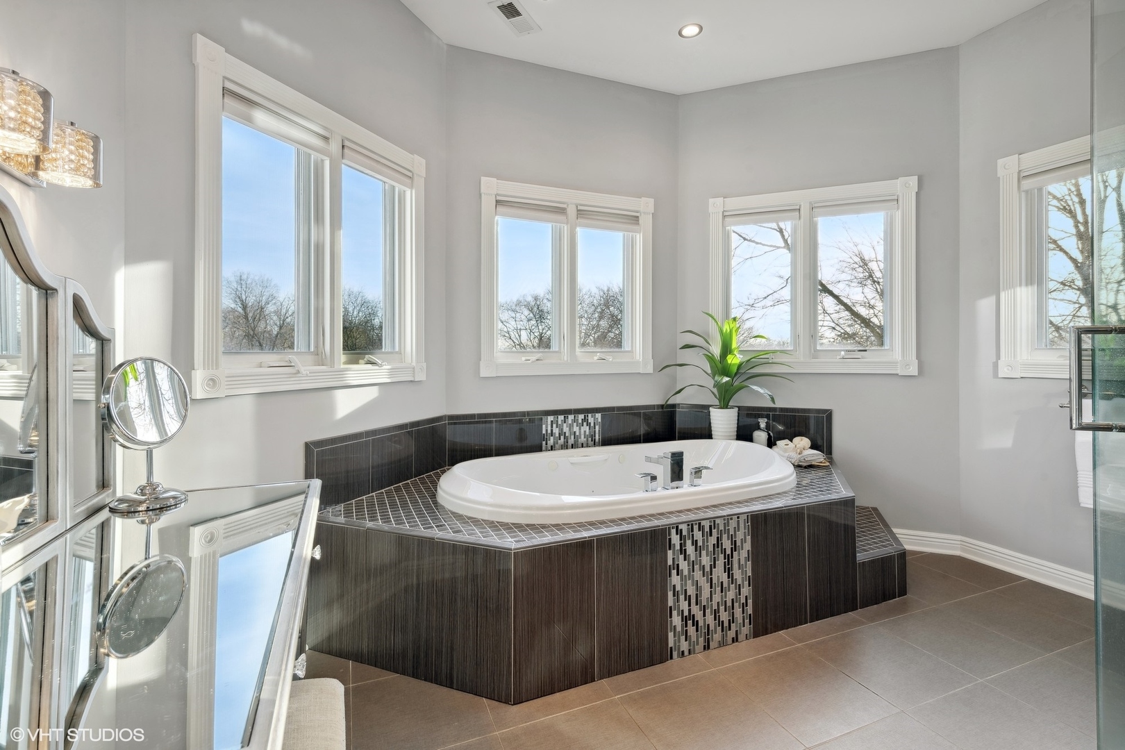 1853 Checker Road Long Grove, IL 60047 - Photo 36 of 63 a spacious bathroom with a tub double sink window and mirror