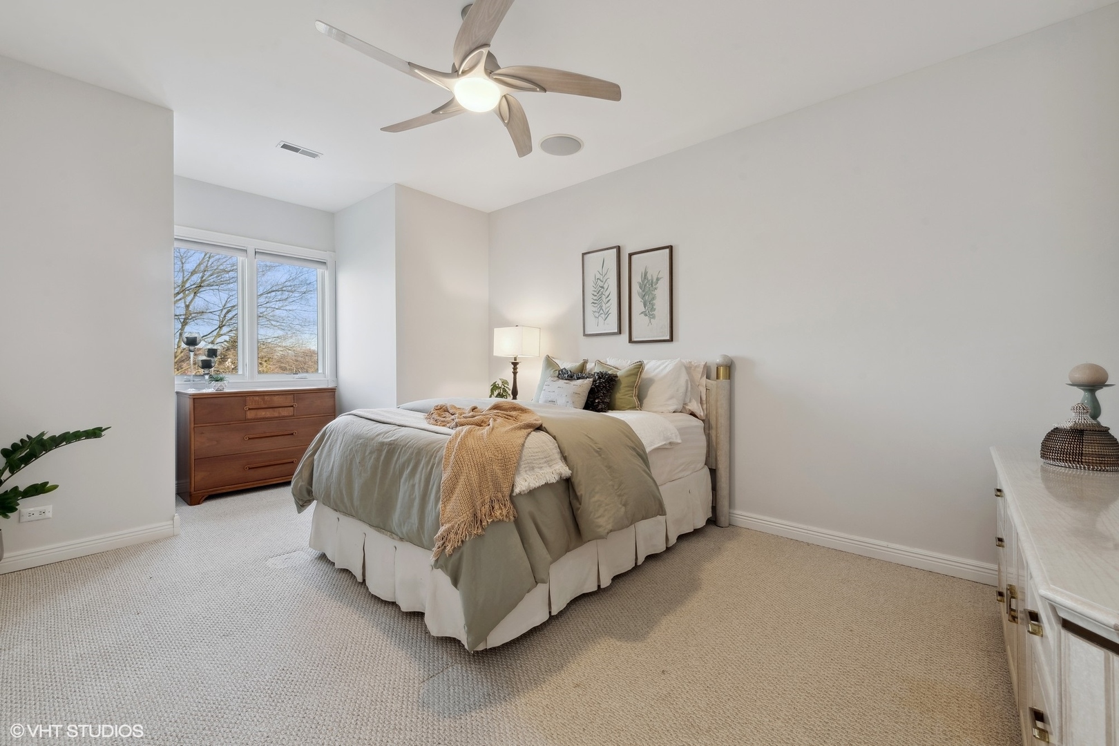1853 Checker Road Long Grove, IL 60047 - Photo 42 of 63 a spacious bedroom with a bed and a chandelier