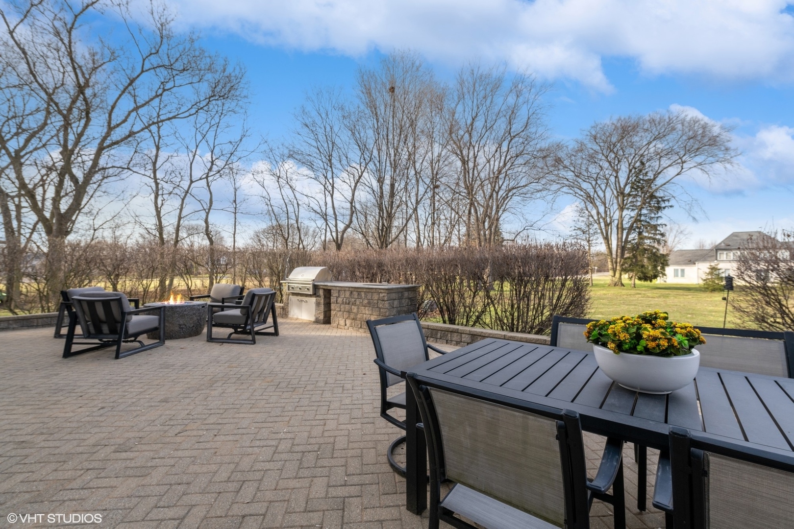 1853 Checker Road Long Grove, IL 60047 - Photo 52 of 63 a view of a patio with furniture and a fire pit