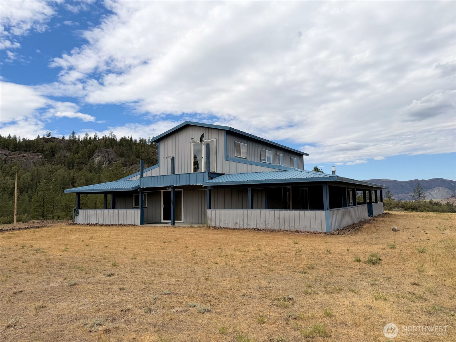 41238 Sterling Valley Road North Lincoln, WA 99147 - Photo 36 of 39 a view of a house with a yard
