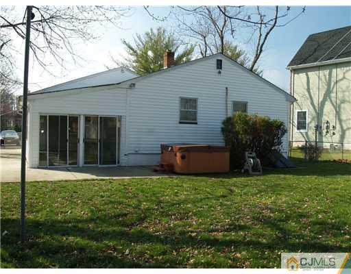 1112 New Dover Road Edison, NJ 08820 - Photo 12 of 25 a view of a house with a yard