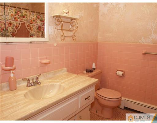 1112 New Dover Road Edison, NJ 08820 - Photo 7 of 25 a bathroom with a sink and a toilet