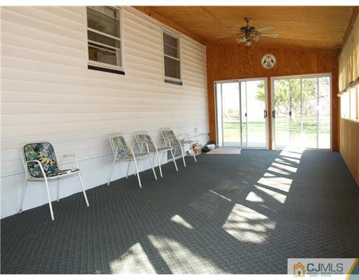 1112 New Dover Road Edison, NJ 08820 - Photo 8 of 25 a living room with furniture and wooden floor