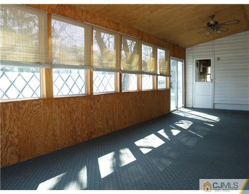 1112 New Dover Road Edison, NJ 08820 - Photo 9 of 25 a view of an empty room with a window