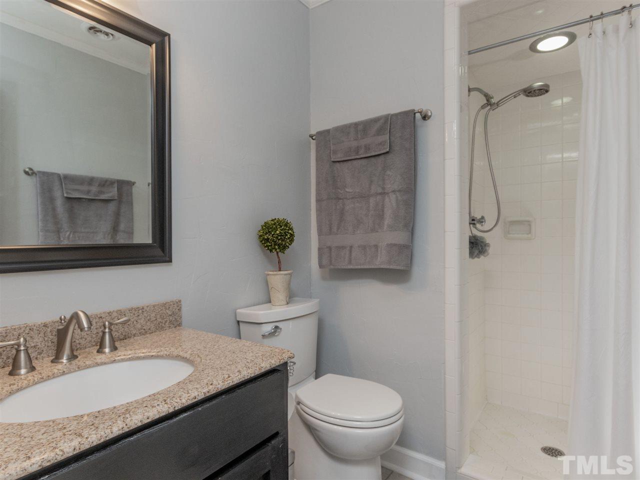 625 Ted Avenue Raleigh, NC 27614 - Photo 22 of 30 a bathroom with a granite countertop sink toilet and shower