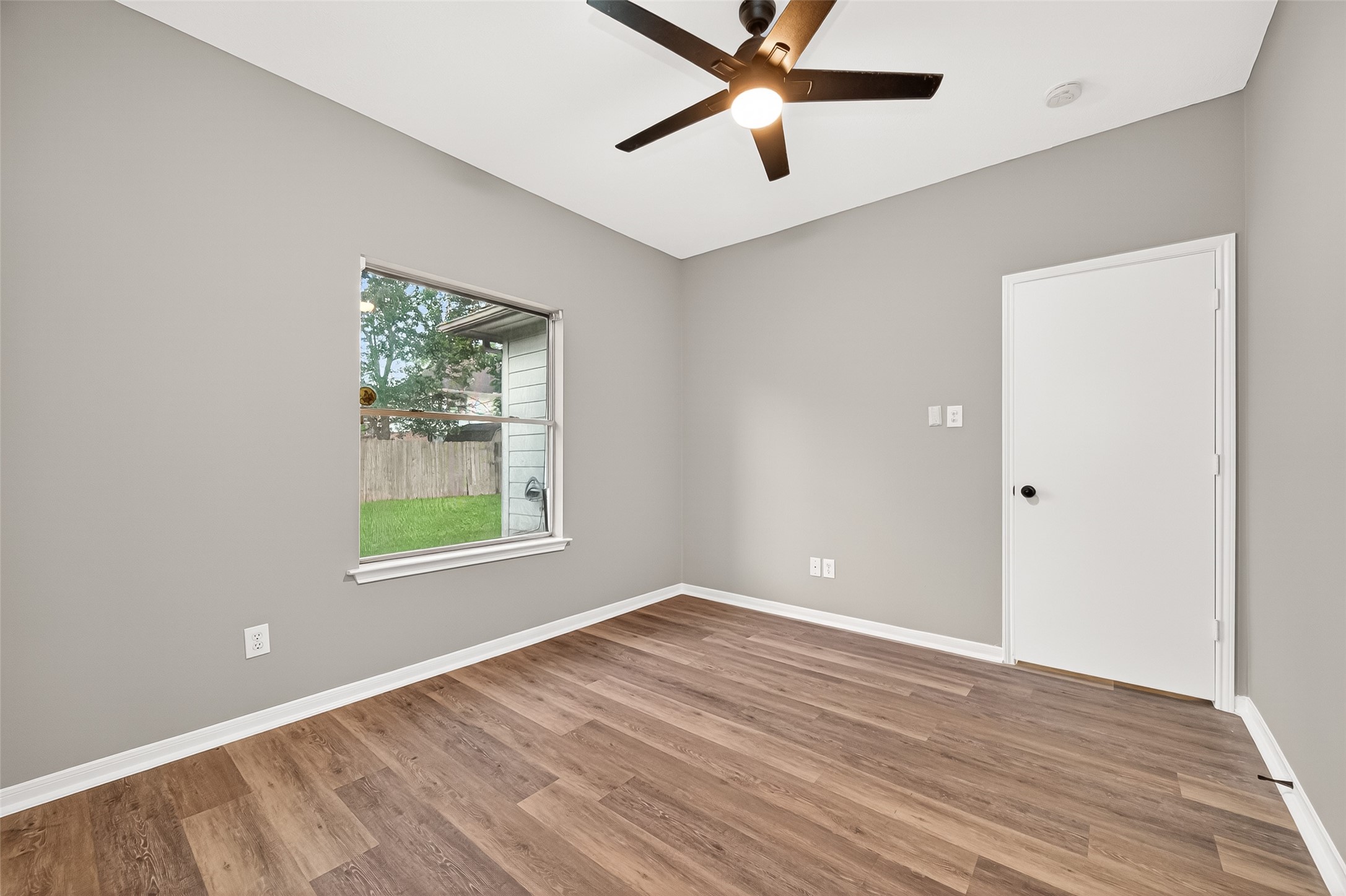 23810 Spring Way Drive Spring, TX 77373 - Photo 31 of 35 wooden floor in an empty room with a window
