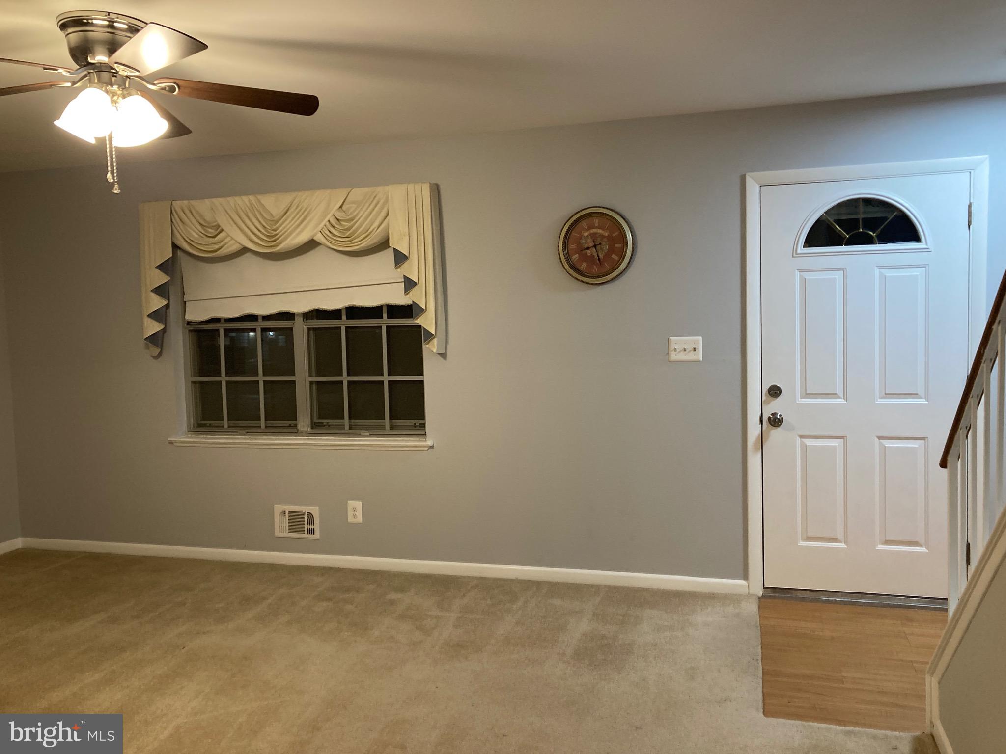 706 Crosby Road Baltimore, MD 21228 - Photo 2 of 41 a view of a livingroom with a chandelier fan and a window