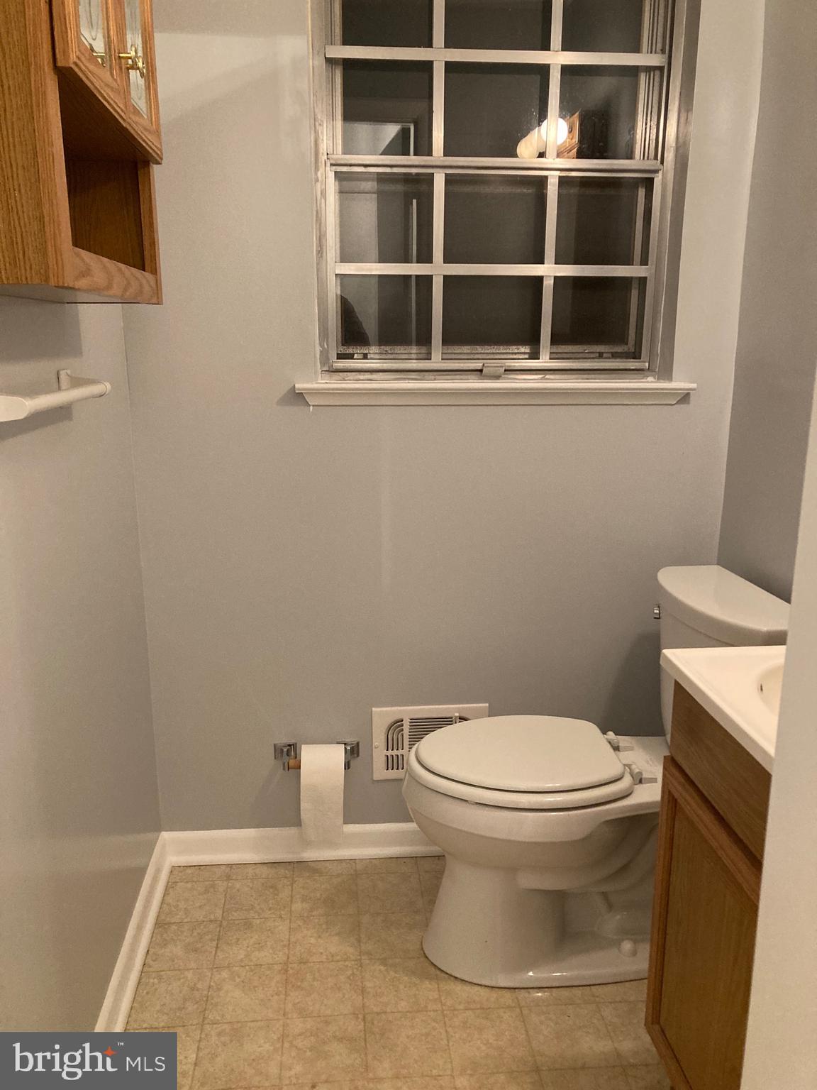 706 Crosby Road Baltimore, MD 21228 - Photo 29 of 41 a bathroom with a toilet and a sink