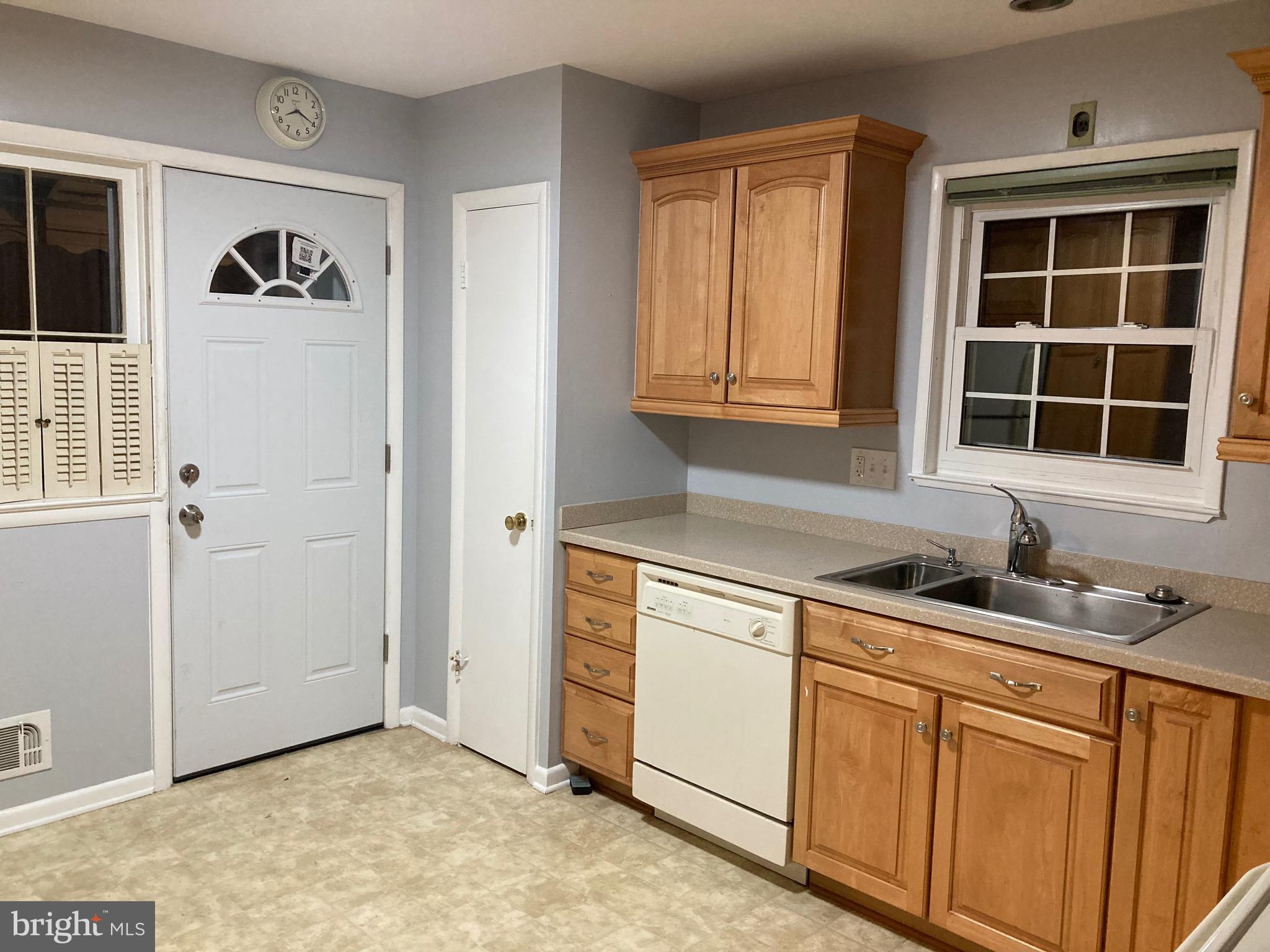706 Crosby Road Baltimore, MD 21228 - Photo 41 of 41 a kitchen with granite countertop a sink and a window