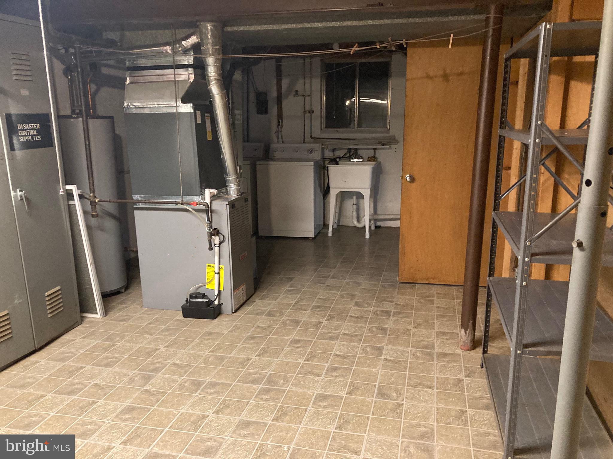 706 Crosby Road Baltimore, MD 21228 - Photo 8 of 41 a view of a refrigerator with wooden floor