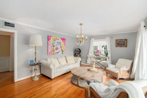 a living room with furniture and a table