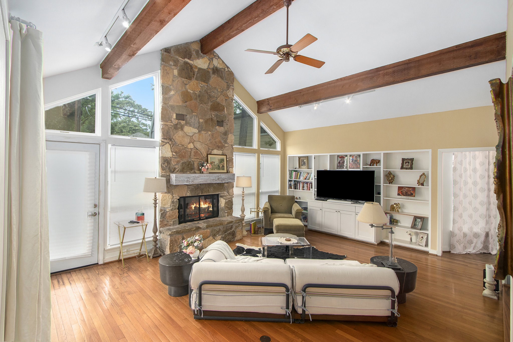 2522 Wordsworth Street Houston, TX 77030 - Photo 3 of 33 a living room with furniture a fireplace and a flat screen tv