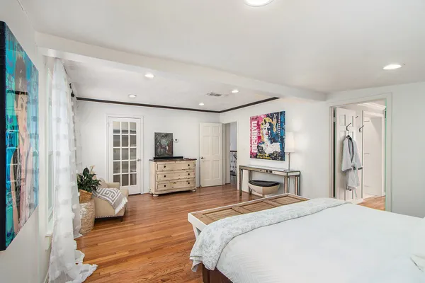 a bedroom with furniture and window
