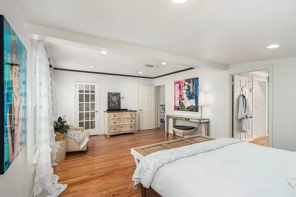 a bedroom with furniture and window