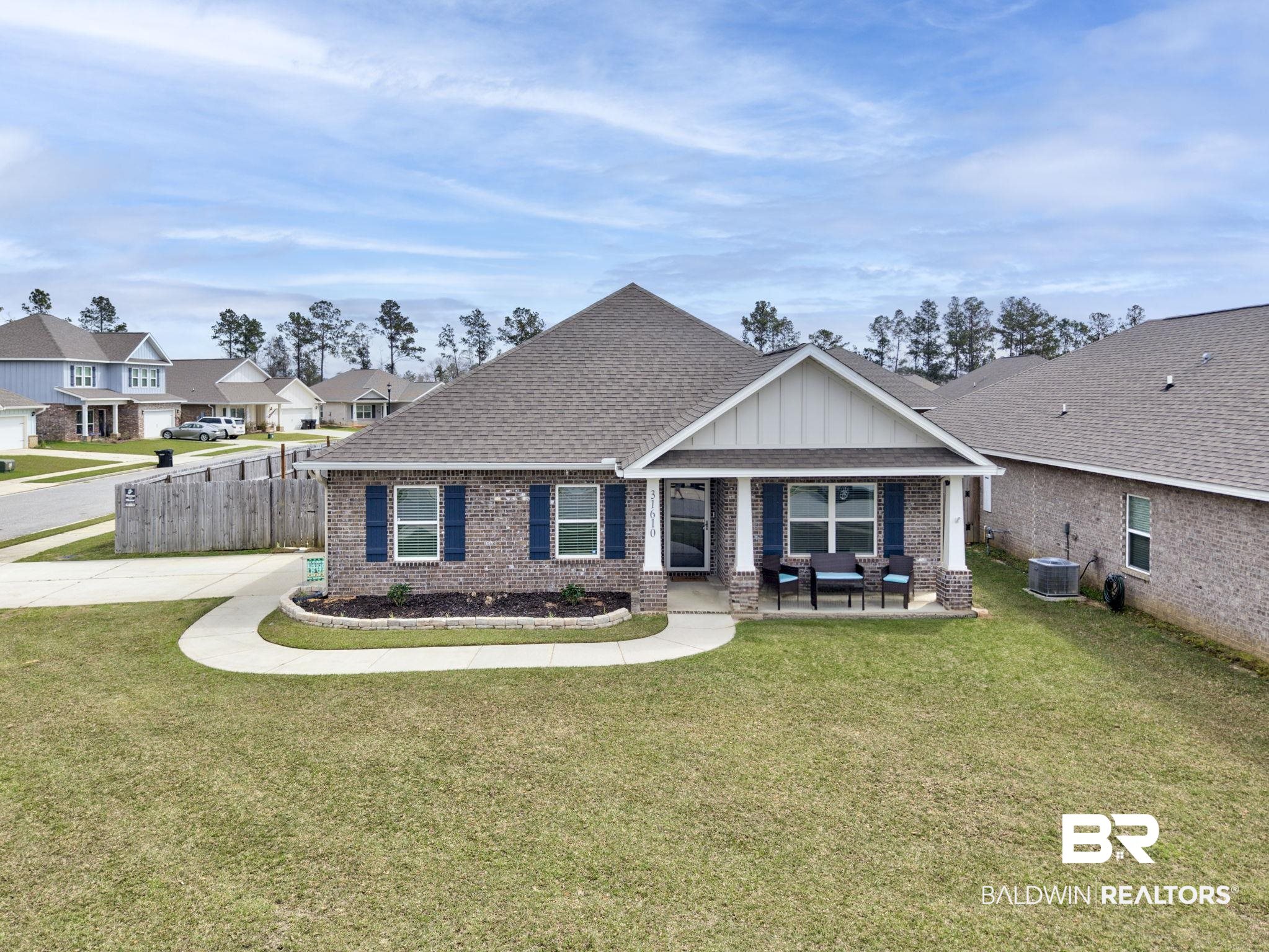 31610 Memphis Loop Daphne, AL 36527 - Photo 1 of 67 Craftsman inspired home featuring a front yard, central AC unit, brick siding, and roof with shingles