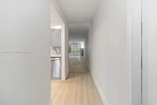 a view of a kitchen from the hallway