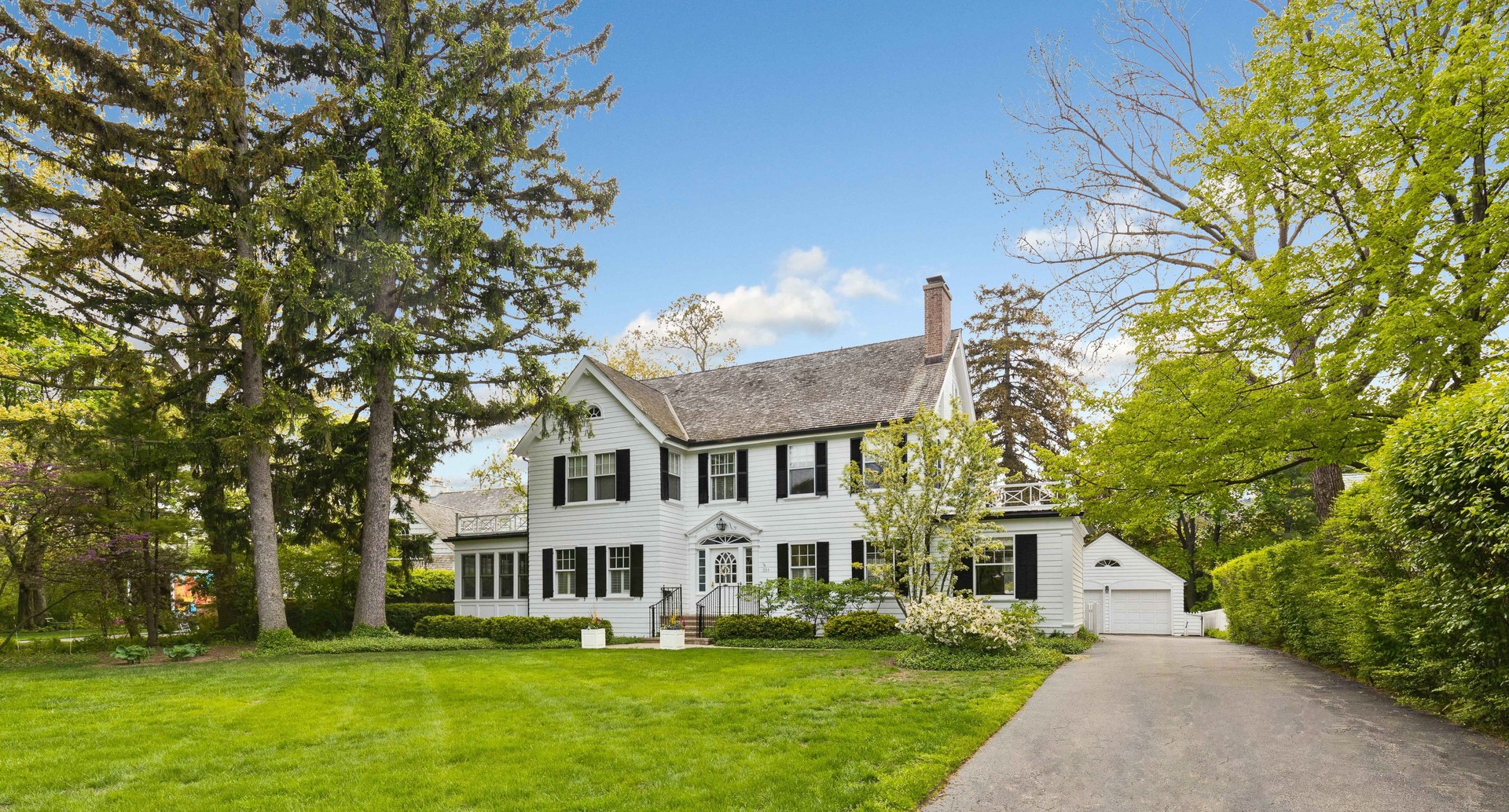 224 Maple Court Lake Forest, IL 60045 - Photo 1 of 51 a front view of a house with a garden