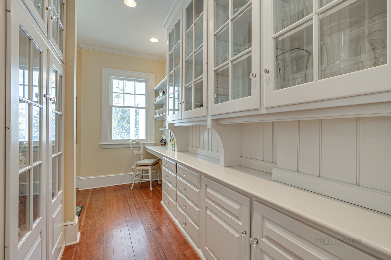 224 Maple Court Lake Forest, IL 60045 - Photo 14 of 51 a kitchen with a white cabinets and wooden floor