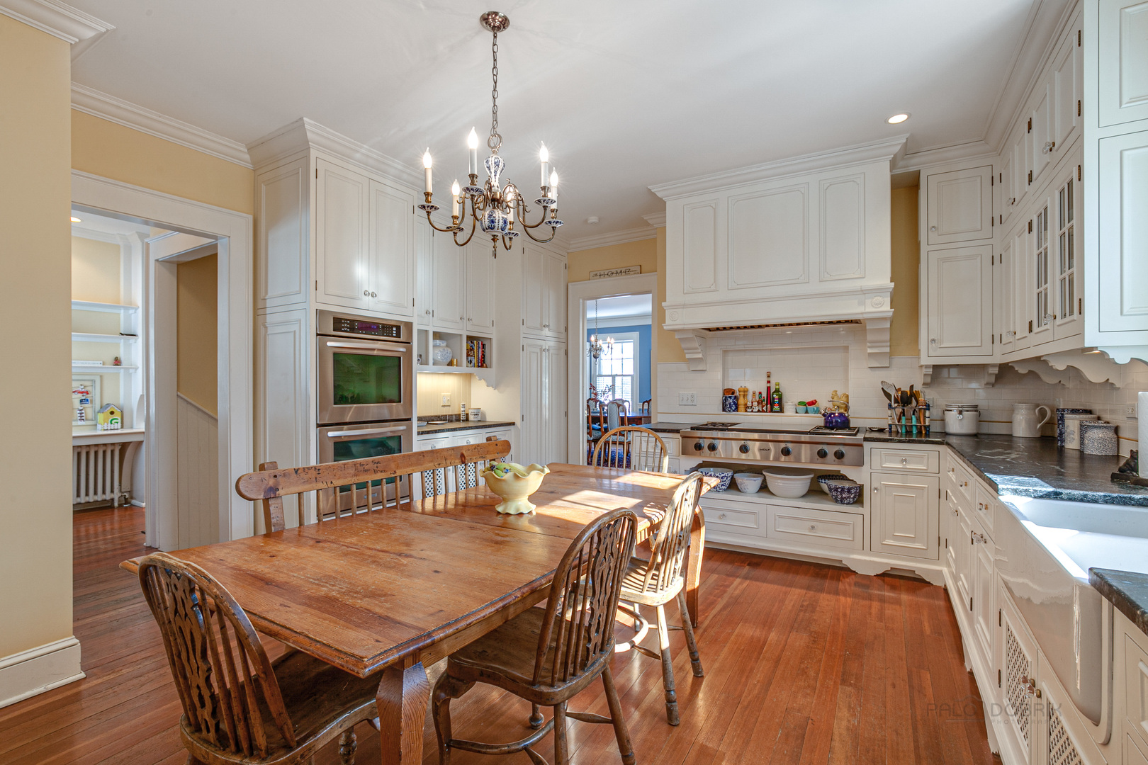 224 Maple Court Lake Forest, IL 60045 - Photo 16 of 51 a view of a dining room with furniture a chandelier and wooden floor