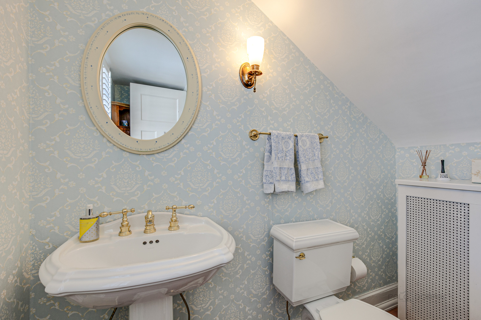 224 Maple Court Lake Forest, IL 60045 - Photo 22 of 51 a bathroom with a toilet a sink and mirror