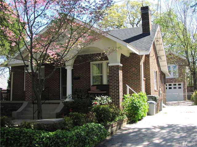 Lovely front porch with view of garage and unfinished space above.
