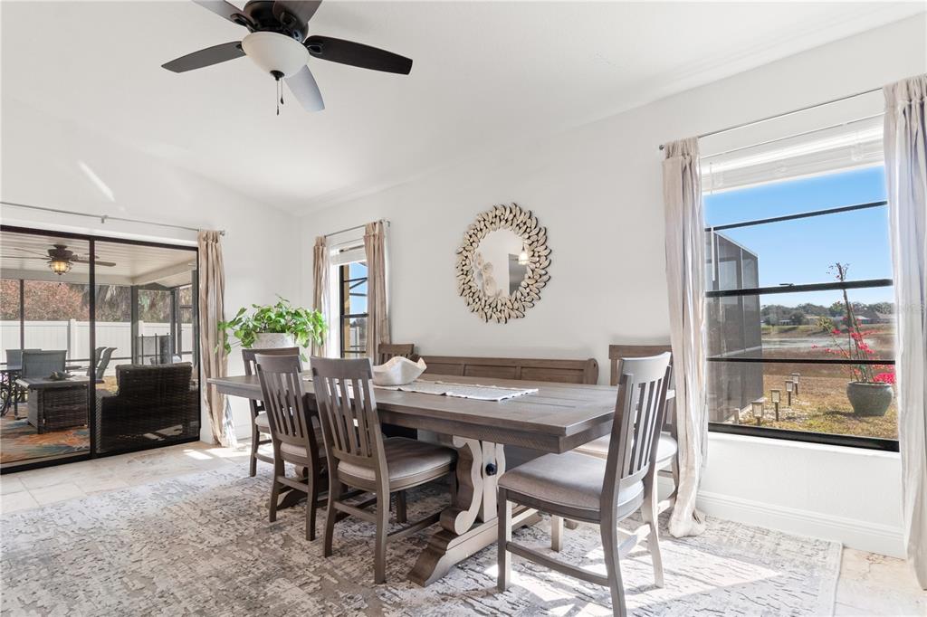 488 Fieldstone Lane Spring Hill, FL 34606 - Photo 13 of 55 a view of a dining room and livingroom with furniture window and a kitchen view